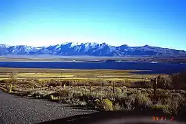 Mono County, CA: Crowley Lake and Glass Mountain Ridge, southwest view; Glass Mountain: highest peak (3395 m) in centre left; November 1994