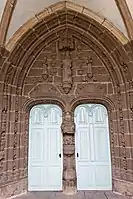 The two doors inside the porch leading to the church