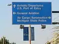 Arrival, Departure, and Port of Entry sign along Capital City Blvd.