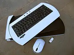 White wireless keyboard, with thumb drive and wireless mouse