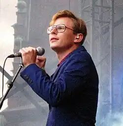 Man holding microphone on stage