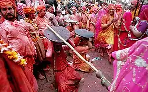In the Braj region of North India, women have the option to playfully hit men who save themselves with shields; for the day, men are culturally expected to accept whatever women dish out to them. This ritual is called Lath Mar Holi.