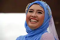 Laughing woman in Kuala Lumpur wearing a blue headscarf, 2008.