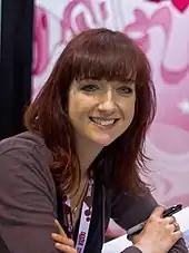 Lauren Faust smiling towards the camera at the 2012 WonderCon