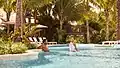 Couple in the lazy river at Harborside Pool Club at The Boca Raton