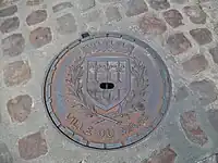 Manhole cover depicting the city's coat-of-arms