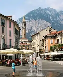 Piazza XX Settembre, in the centre of the town, and the San Martino mountain.