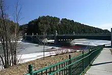 A bridge crosses an icy river