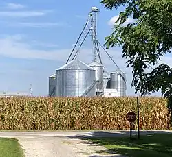 View north from Madison Street toward corn fields and grain elevators