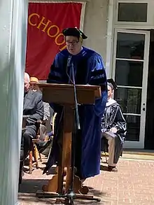 Oser giving the Trivium School commencement speech in 2021