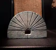 image of an Ancient Egyptian sundial (an engraved a semicircular-shaped rock