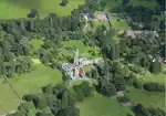 Aerial view showing the house in the centre of the image and the walled garden to the top right