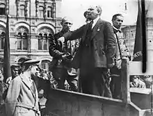 Lenin making a speech from the back of a vehicle before troops in the Red Square, 1919