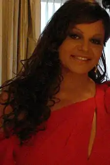 A brunette women in a red dress.