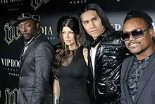 Four members of The Black Eyed Peas at a conference