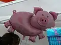 Pig-related souvenirs and balloons
