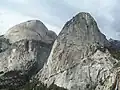 In 1969, Harding and photographer Galen Rowell climbed the south-west face of Liberty Cap, the feature on the right next to Nevada Falls in Little Yosemite Valley.  In 1970, the pair returned for a major epic climbing the long slabby South Face of Yosemite's Half Dome on the left behind; their route following the distinctive arch to its top and then went straight up.