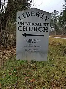 Signage to the Liberty Universalist Church show date founded (1777) and date constructed (1882)