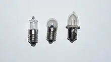 Three miniature bulbs: tubular bulb with screw base, globular bulb with screw base, and prefocus bulb with flange-mount base