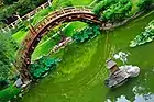 Moon bridge with a "woven-arch" construction