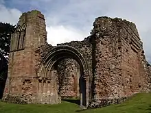 Western end of remains of the church, showing the main west portal and the still-massive northern support for the tower.