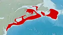 Topological relief map of the Northeast United States and Atlantic Canada, showing the range of Limanda ferruginea along the continental shelf in red