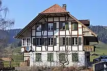 Linden (BE) – Grafenbuehl, a rural half-timbered dwelling house from the south