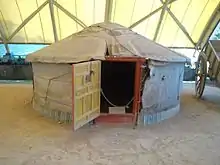 Yurt-shaped tent under cover