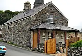 Cottage near church with circular pillars and verandah