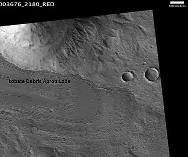 Lobate debris apron in Phlegra Montes, Cebrenia quadrangle. The debris apron is probably mostly ice with a thin covering of rock debris, so it could be a source of water for future Martian colonists. Scale bar is 500 meters long.