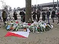 Local residents have brought flowers to commemorate the victims of the tram attack. City flag of Utrecht