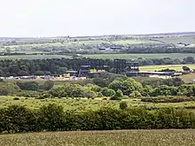 Image of a construction site surrounded by moorland