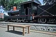 Old 0-6-0 locomotive next to the Lawang Sewu building.