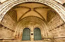 The main porch leading to the double-doored entrance to the church.