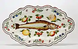 Polychrome majolica dish with paintings of a fish, flowers, and fruit. Lodi, Italy, 1751.
