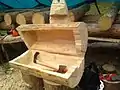 Log furniture: chest from a hollowed log open