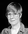 Lois McMaster Bujold with pixie cut and denim western shirt, 1996