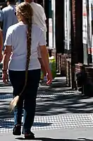 An American woman with knee-length braided hair