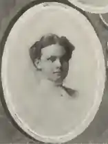 A yearbook picture of a young white woman, in an oval frame.