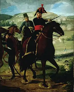 Formal full-length portrait of Turreau mounted on his white horse and leading his troops into battle. He is wearing dress military uniform, comprising white breeches with knee length black boots, dark cutaway coat with high collar and gold embroidery and a red waist sash. He points a marshal's baton..