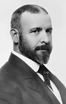  Male profile in a suit and tie.