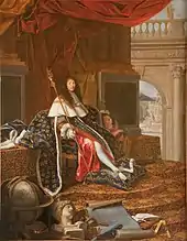 A periwigged man sits on a throne, wearing fleur-de-lis pattern regalia and embracing a child