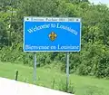 English and French sign in Louisiana, French written to indicate historical link, not so much to be understood