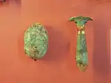 Amulets: scarab and Papyrus