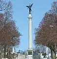 Monument looking up from Monument Avenue. This photo edited to remove the power lines