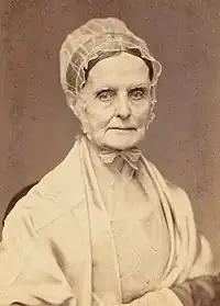 Photograph of Lucretia Mott wearing a pale bonnet and shawl and facing the camera.
