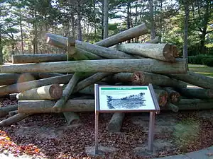 An outdoor exhibit of what a log jam on the river might look like