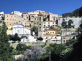 The buildings surrounding the bell tower in Lumio