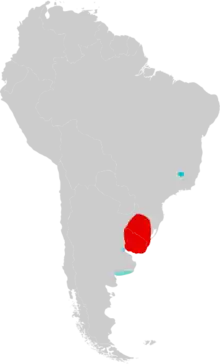 Map of South America marked by red and blue colors, with the red color extending over Uruguay and into Rio Grande do Sul, southern Brazil, and the blue color in southeastern Minas Gerais, eastern Brazil, and in two different areas in northern and southern Buenos Aires Province, eastern Argentina
