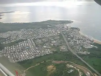 Aerial view of a coastal city from inland